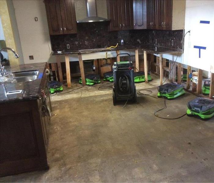 Kitchen Drying After Refrigerator Caused Flood 